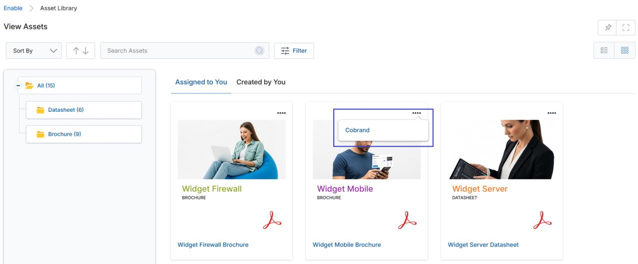 View Assets thumbnail view showing three asset cards with three-dot menus and Cobrand popup